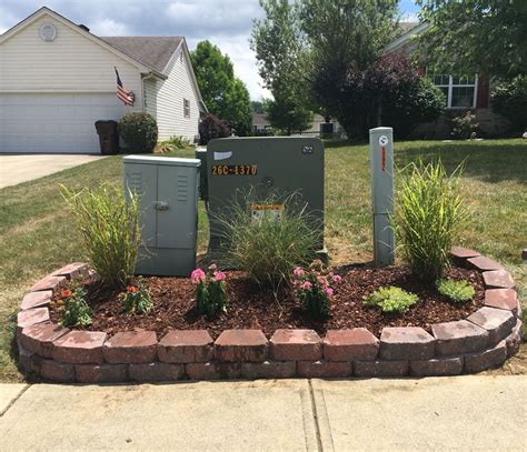 electrical box in ayrd|landscaping around electrical boxes outside.